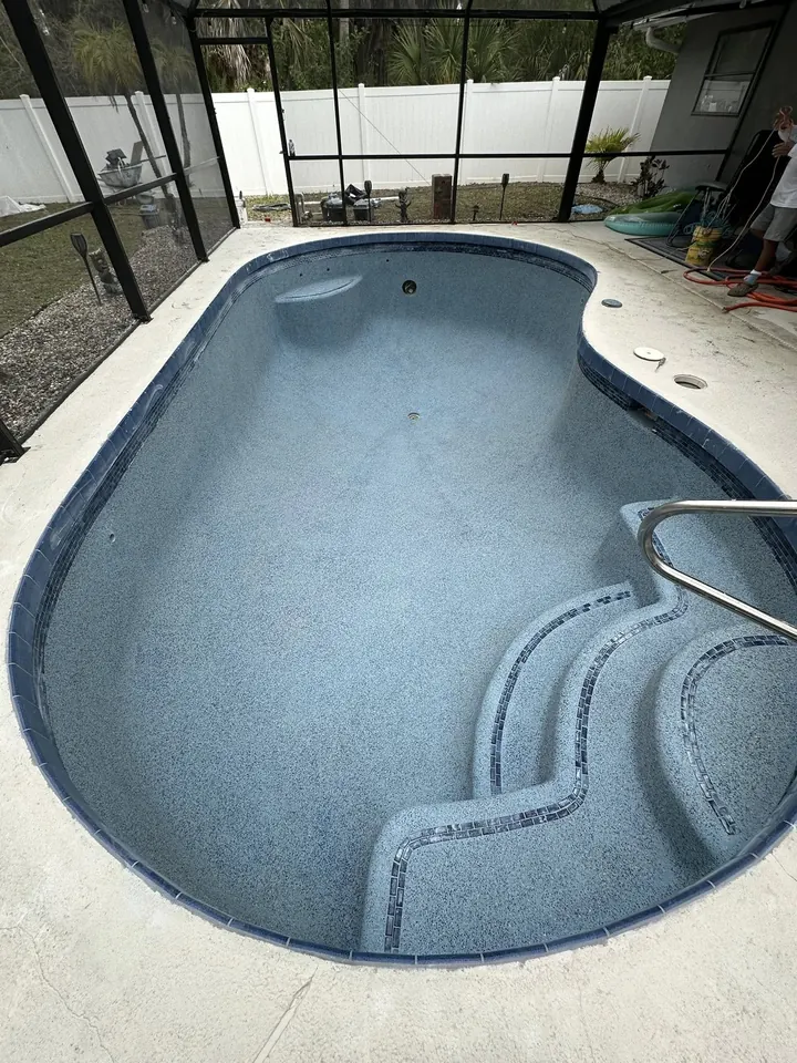 Freshly resurfaced pool with a new blue interior finish
